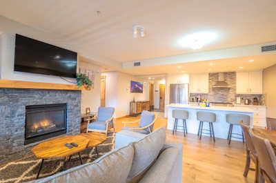 Gather around the cozy fireplace, enjoying warmth and comfort in this stylish living space.