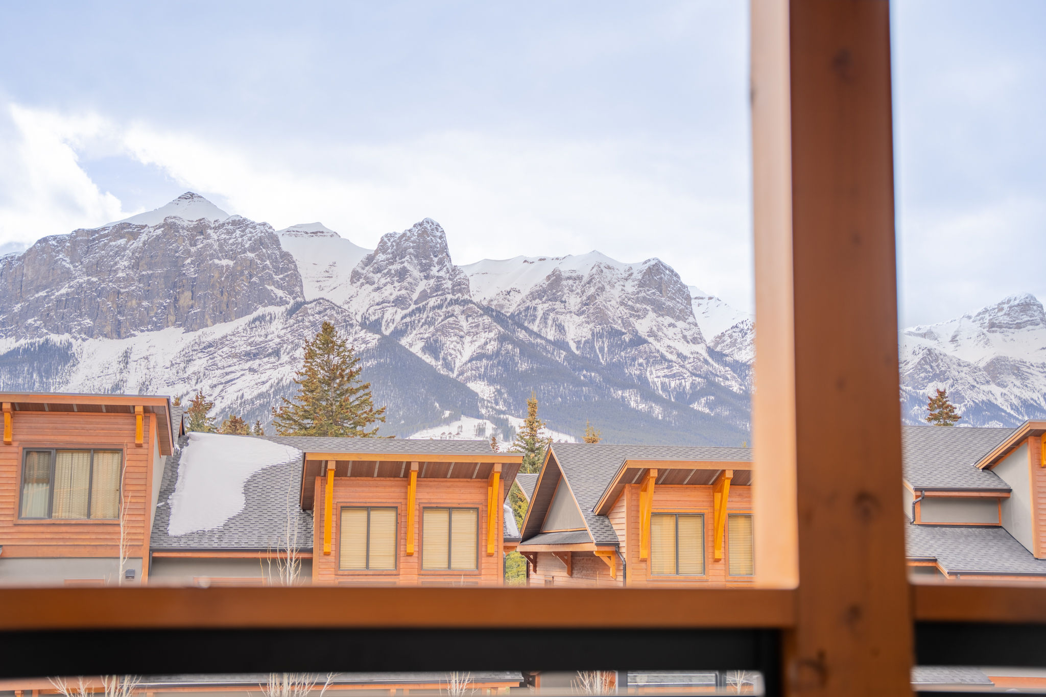 image Take in the crisp mountain air from your window, framing a winter wonderland of snow-capped peaks.