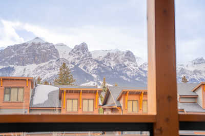 Take in the crisp mountain air from your window, framing a winter wonderland of snow-capped peaks.