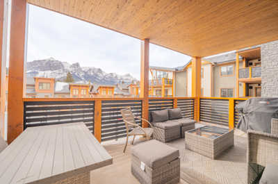 Savor mountain views and fresh air from your private covered balcony with relaxing seating.