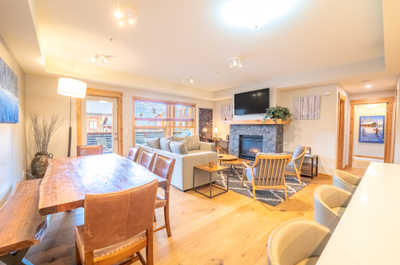 Experience effortless entertaining in the open layout, featuring a dining table ready for your next meal.