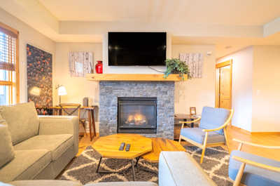 Gather around the fireplace, streaming your favorite shows on the flat-screen TV.