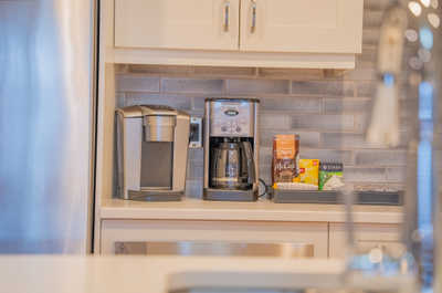 Brew your perfect morning cup with a choice of coffee makers, just steps away from your gourmet kitchen.