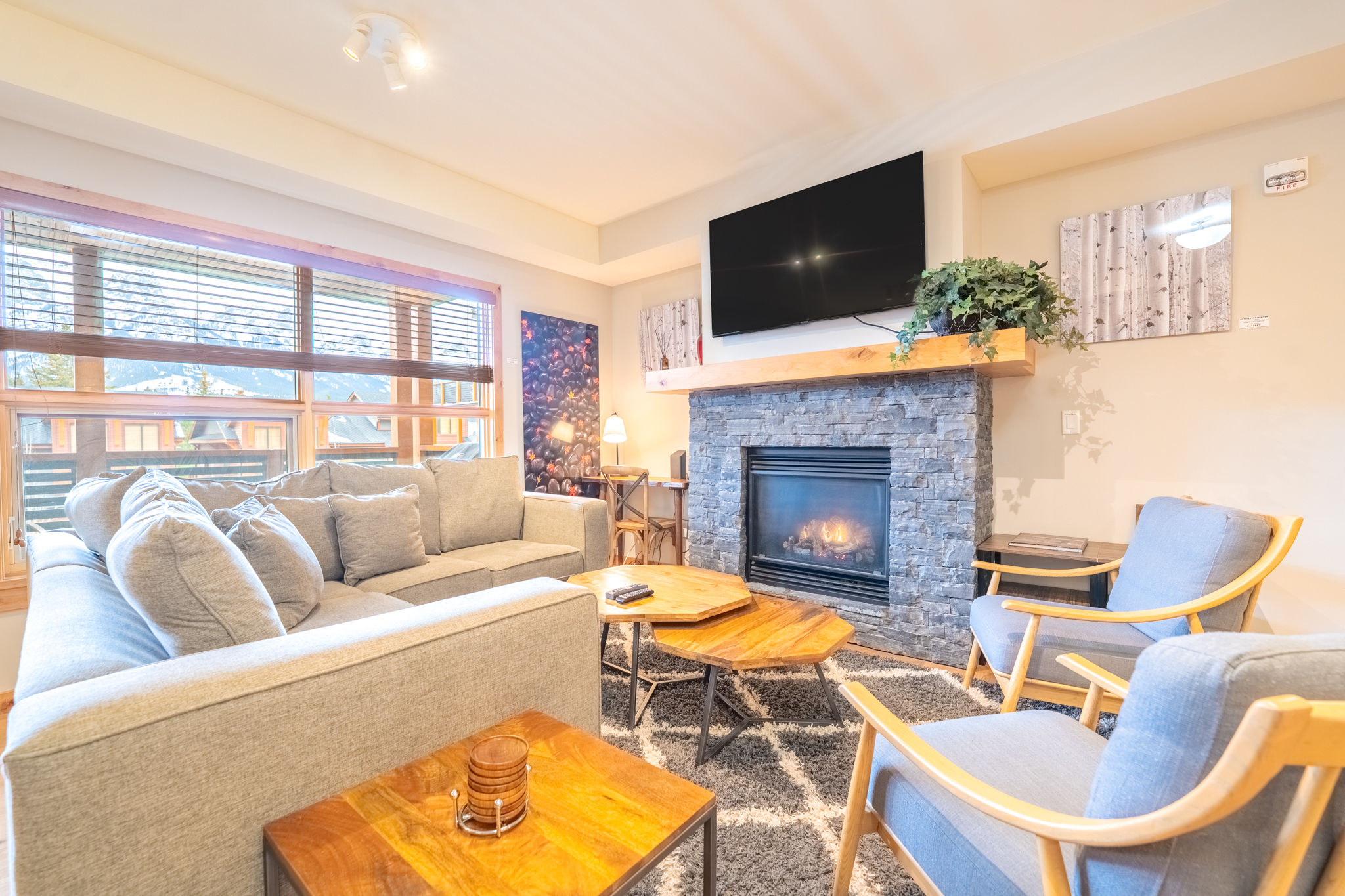 image Unwind in the inviting living room, accented by stylish décor and a perfect view of the outdoors.