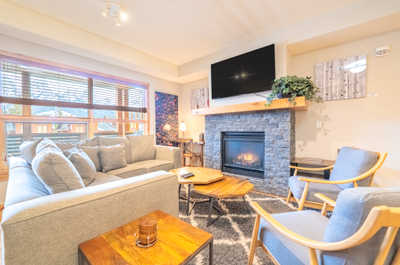 Unwind in the inviting living room, accented by stylish décor and a perfect view of the outdoors.