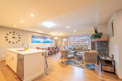 Gather in the spacious living area, where stylish furnishings meet a welcoming atmosphere—perfect for relaxation.