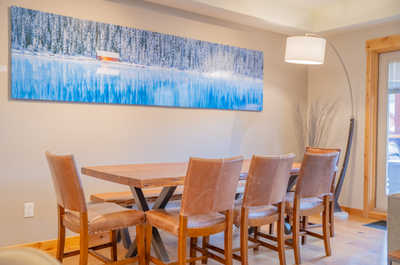 Gather around the rustic dining table, perfect for sharing stories over a delicious meal.