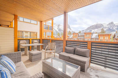 Relax on your private balcony, the perfect spot for memorable evenings with friends amid stunning mountain views.