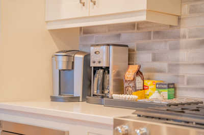 Brew your favorite coffee in a well-equipped kitchen, ready for your morning ritual.