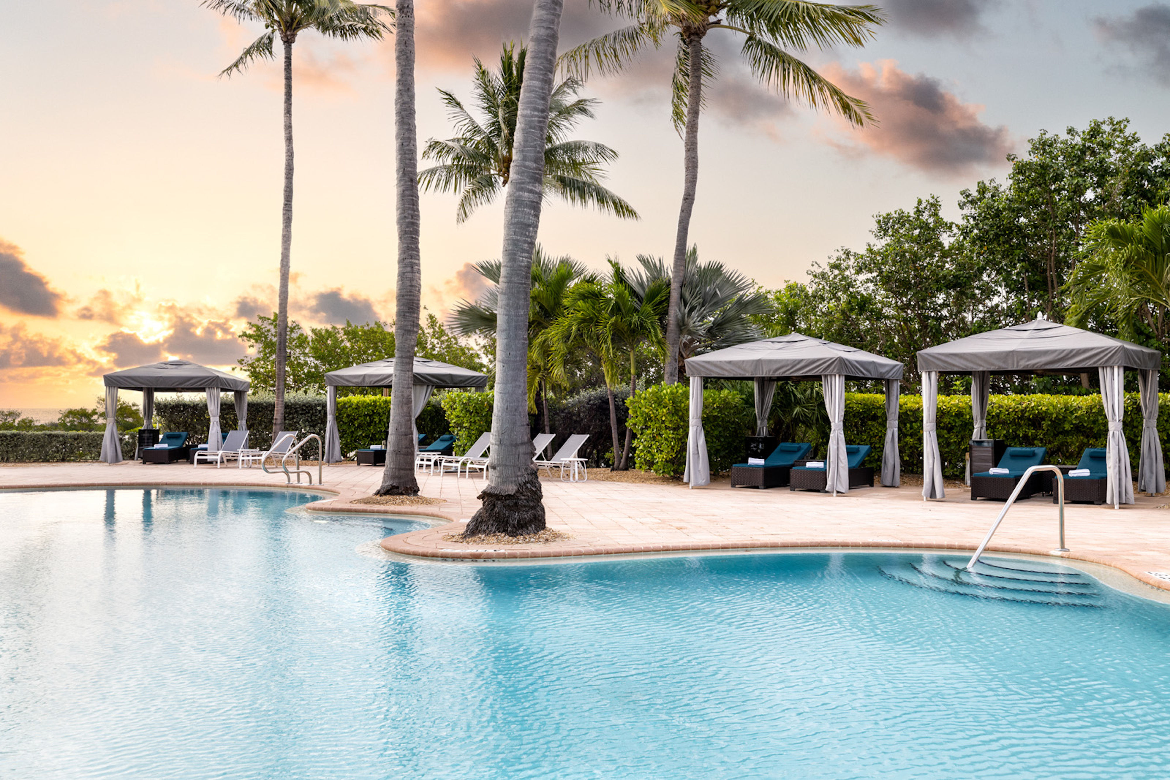 image Relax and let your cares drift away at the Oasis Cay pool area reserved for guests 21 years of age and older.