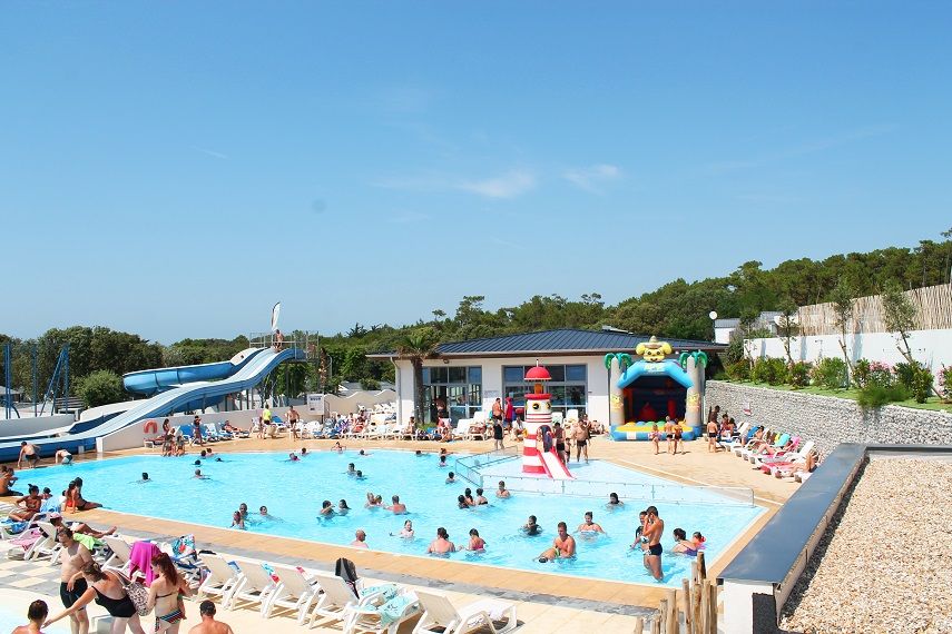 image Guests cool off in a spacious resort pool.