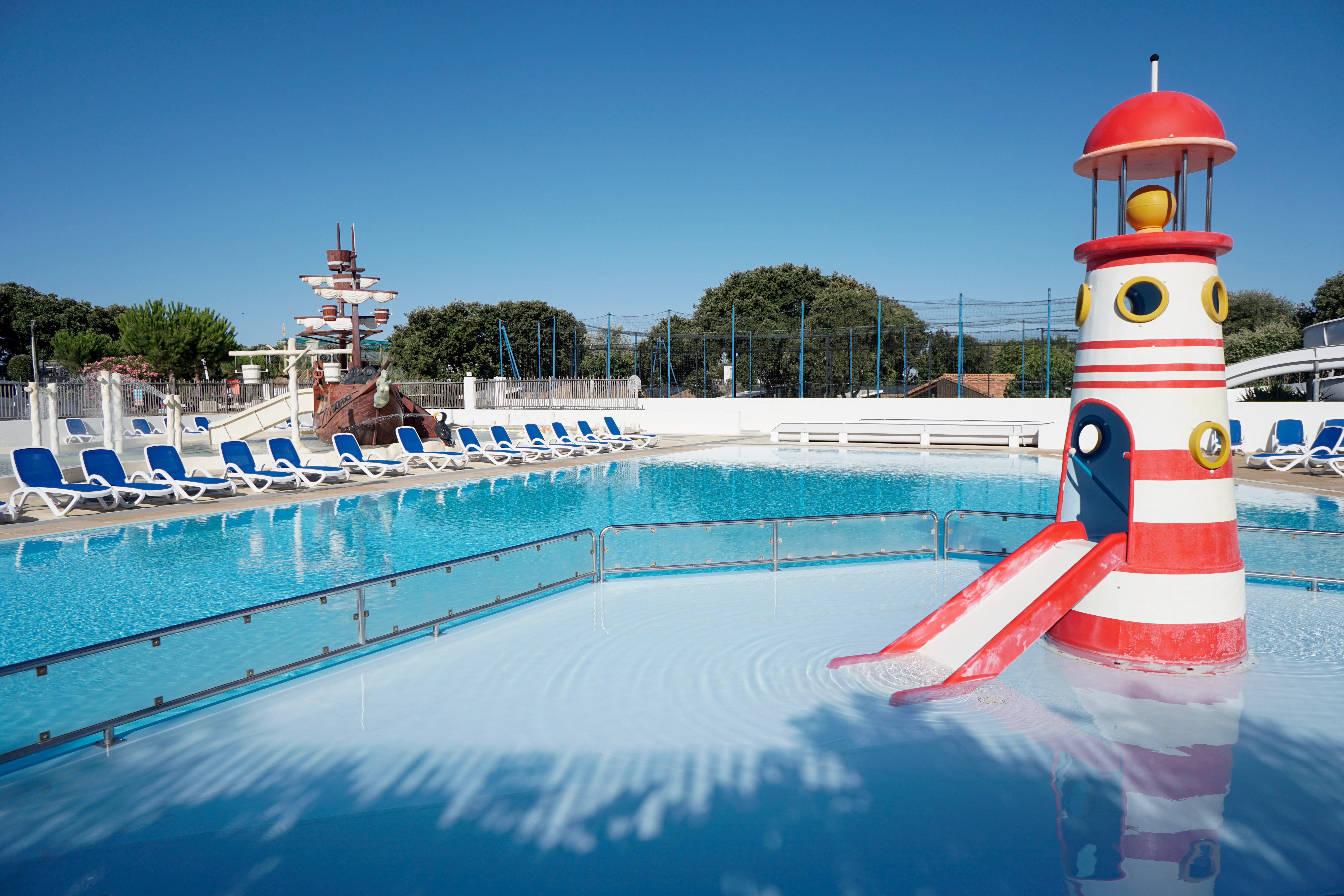 image The resort’s signature lighthouse slide adds seaside charm to the family pool.