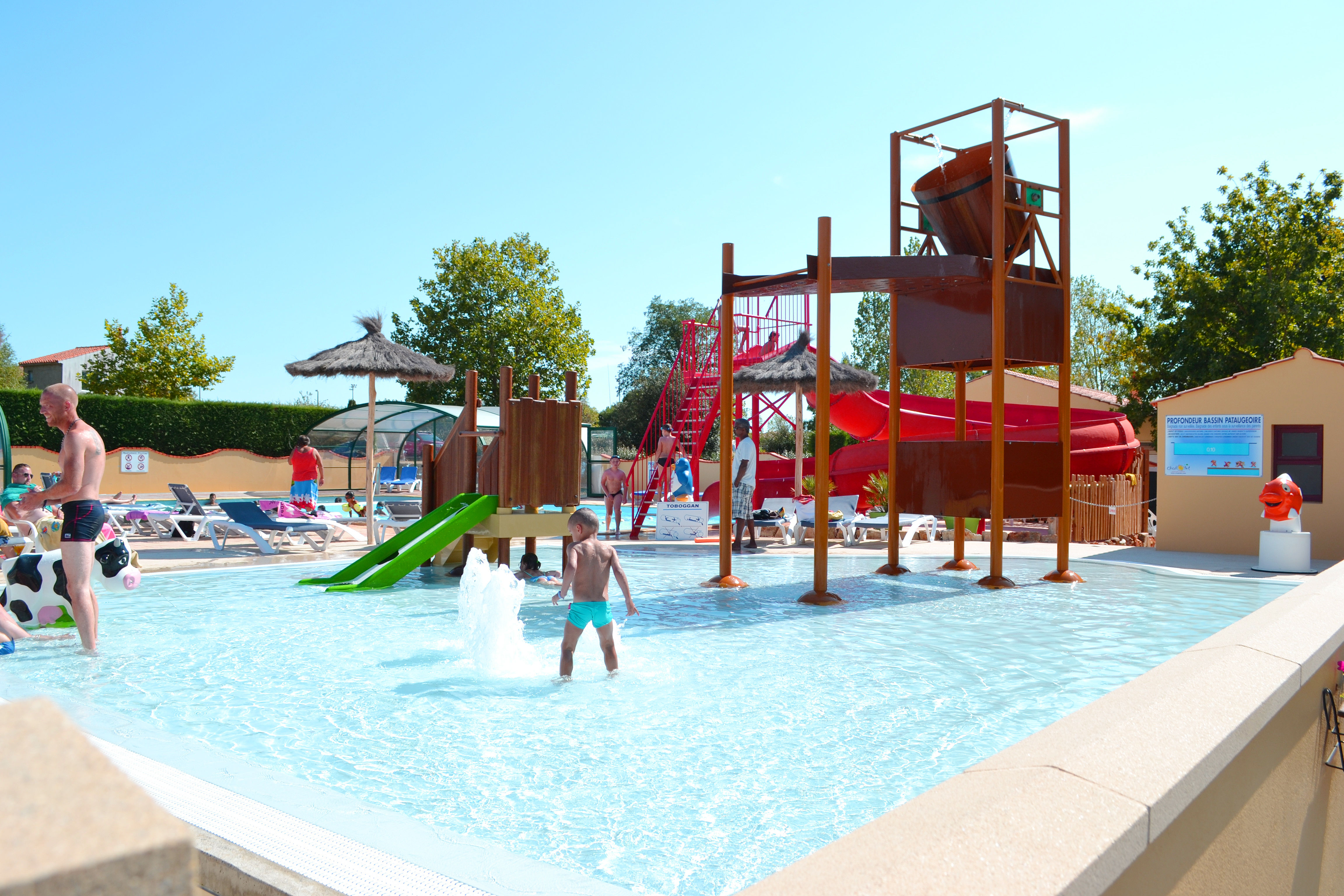 image Vibrant water playground with multiple slides and splash areas, providing endless enjoyment for guests of all ages.