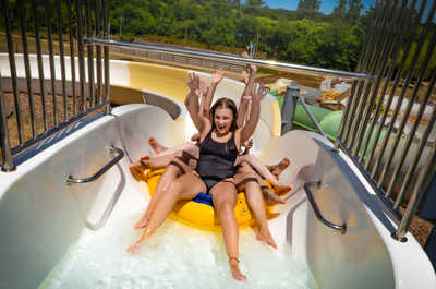 Exciting water slide action in a double tube.