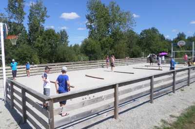 Players enjoy a game of petanque.