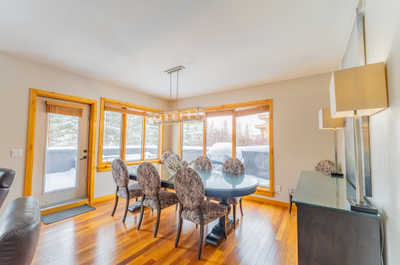 Dining area with a table, chairs, and a pendant light