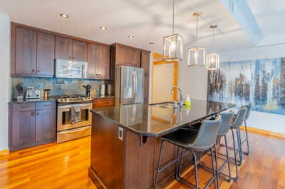 Kitchen with stainless steel appliances and cabinetry