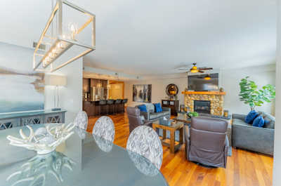 Living room with stone fireplace and seating area