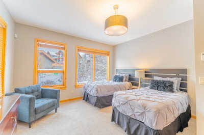 Bedroom with two beds and natural light