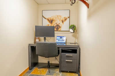 Desk and computer setup in a small workspace