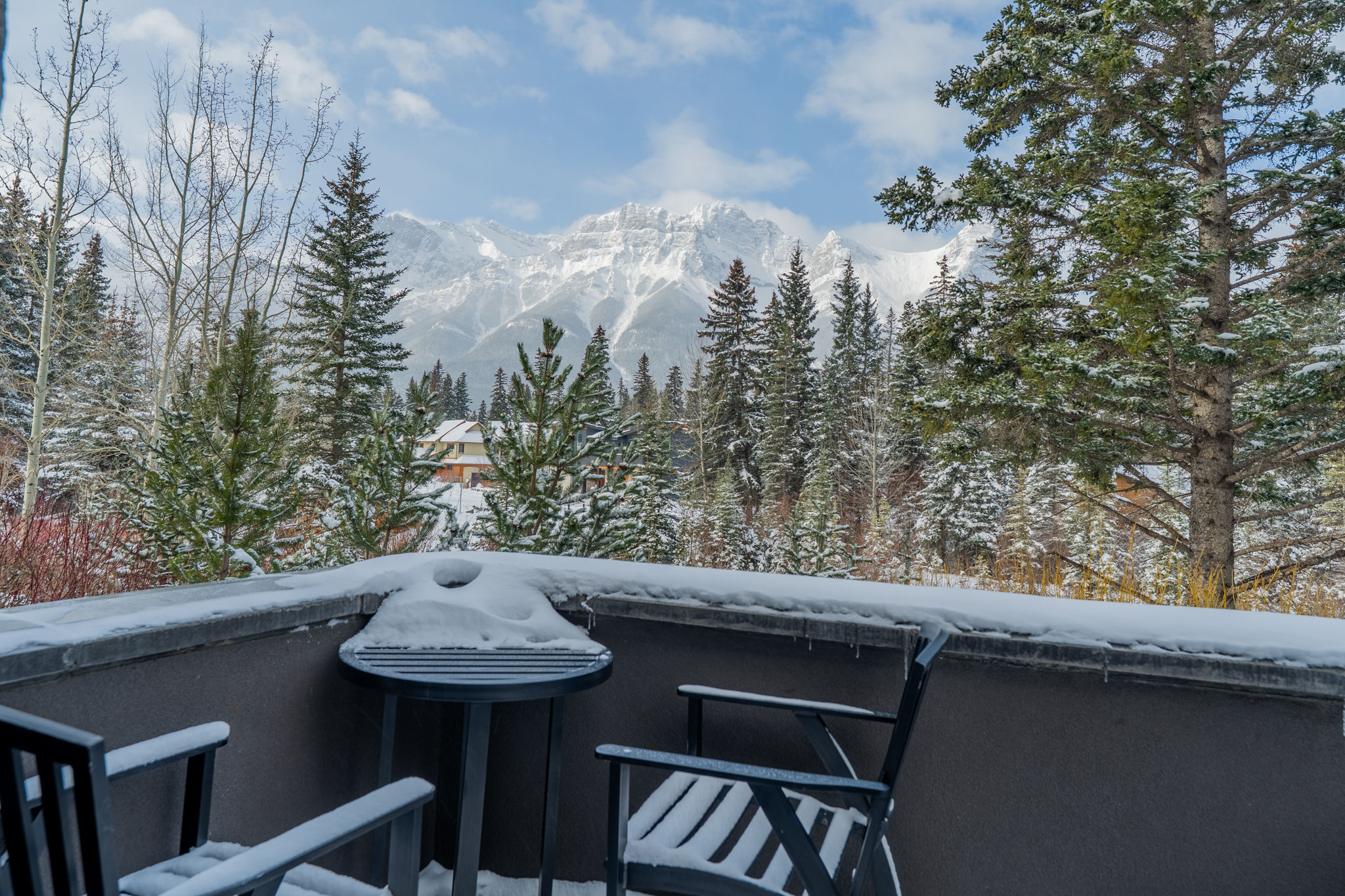 image Snow-covered deck with distant mountain views