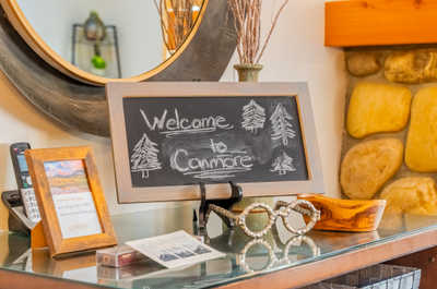 Welcome sign with decorative items on a table