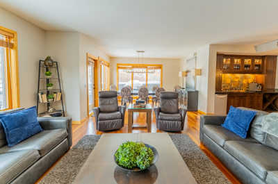 Living room with multiple seating areas and dining table