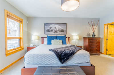 Bedroom with a bed, side tables, and decor