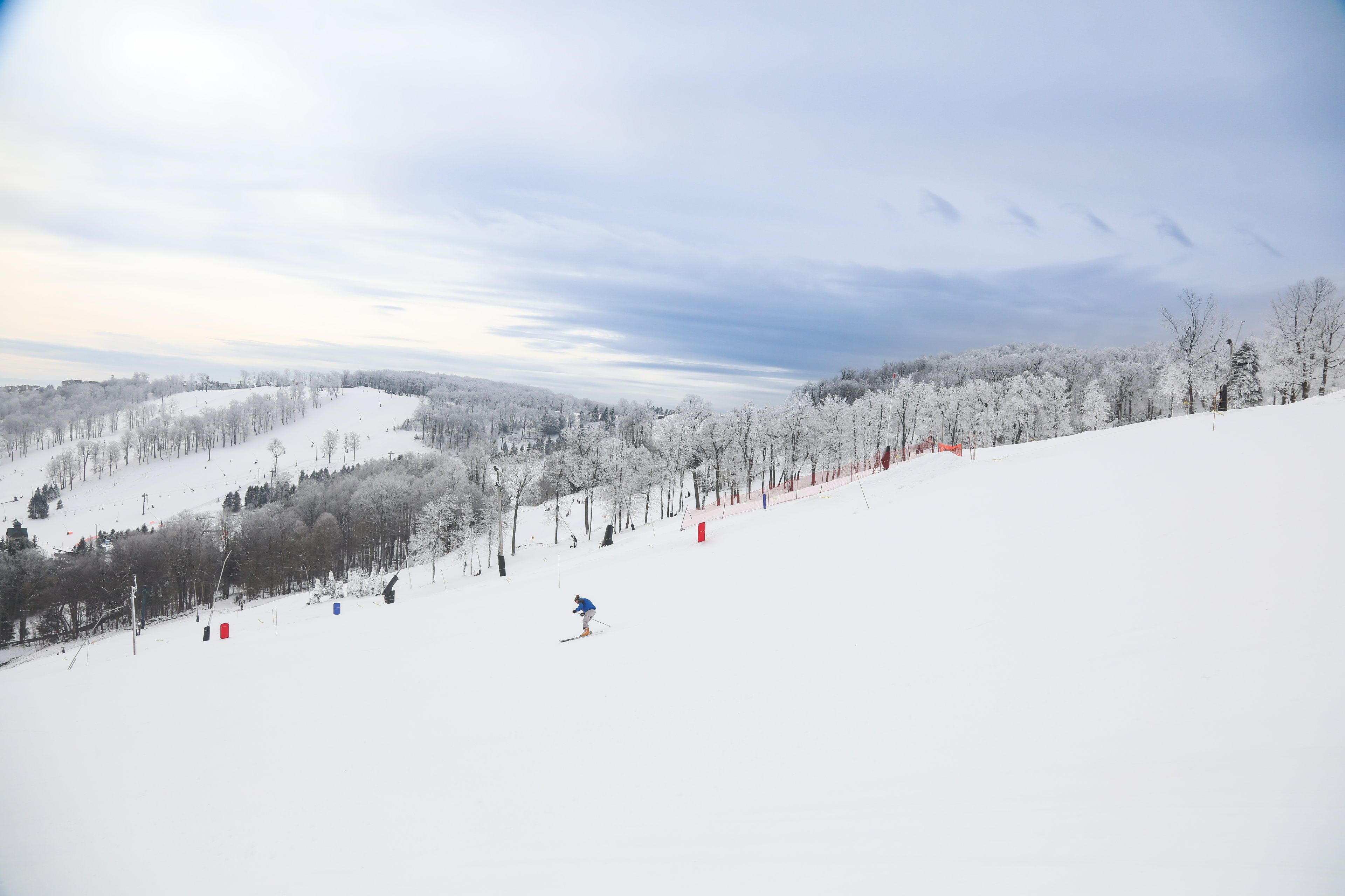 image The expansive white slopes stretch across the horizon, inviting winter sports enthusiasts to embrace the exhilarating chill of the season.