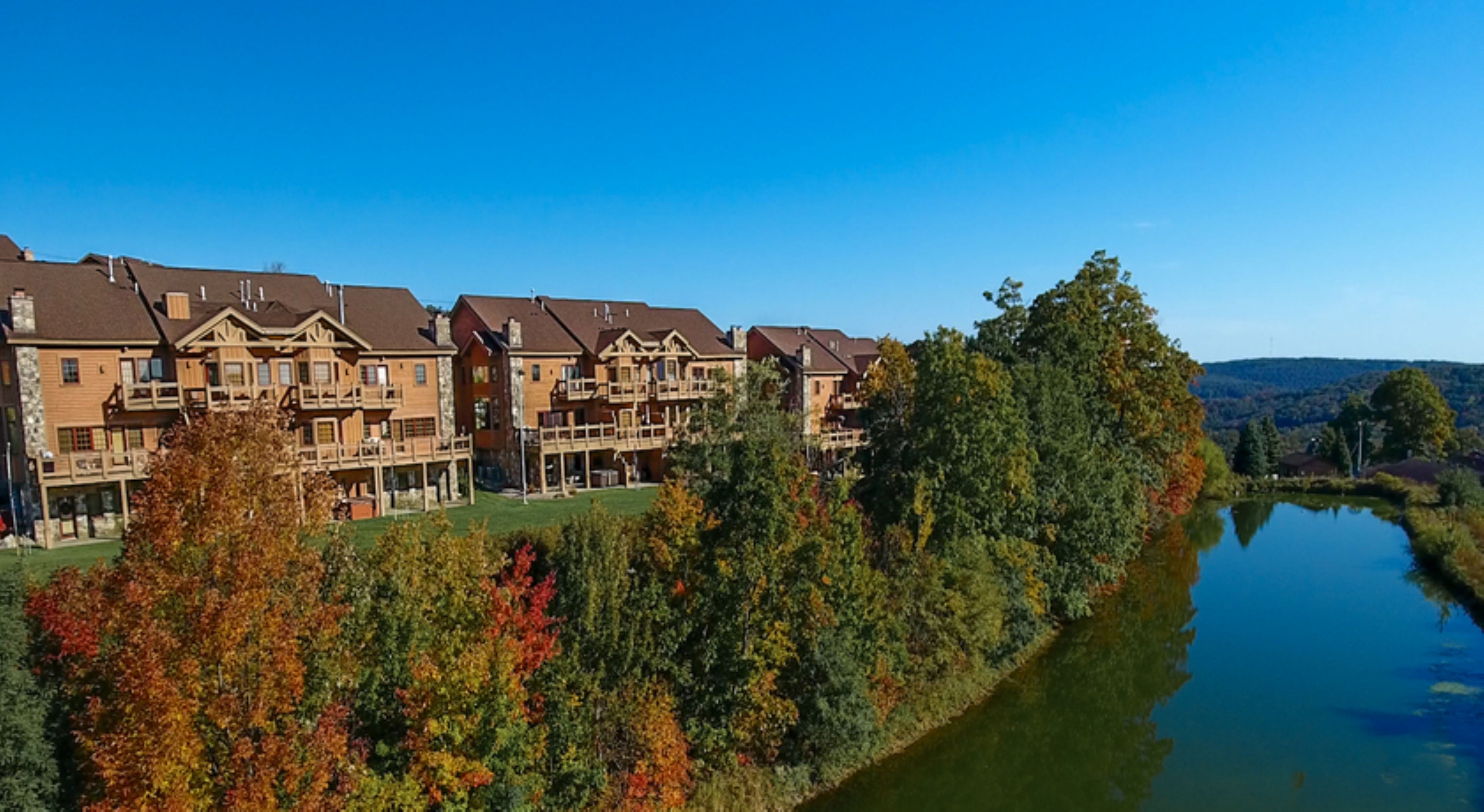 image Cozy lodges reflect the natural beauty of the landscape, creating a peaceful retreat by the water.