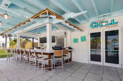 Savor refreshing drinks and light bites in a stylish poolside bar with a laid-back vibe.