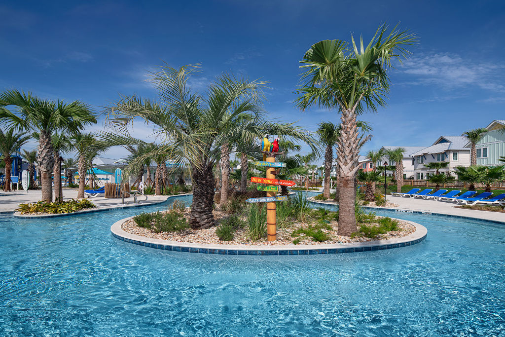 image Experience relaxation surrounded by palm trees in our lagoon-like pool.