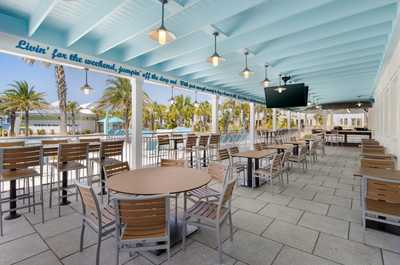 Savor the laid-back vibe at the outdoor dining space, perfect for enjoying a meal with friends.