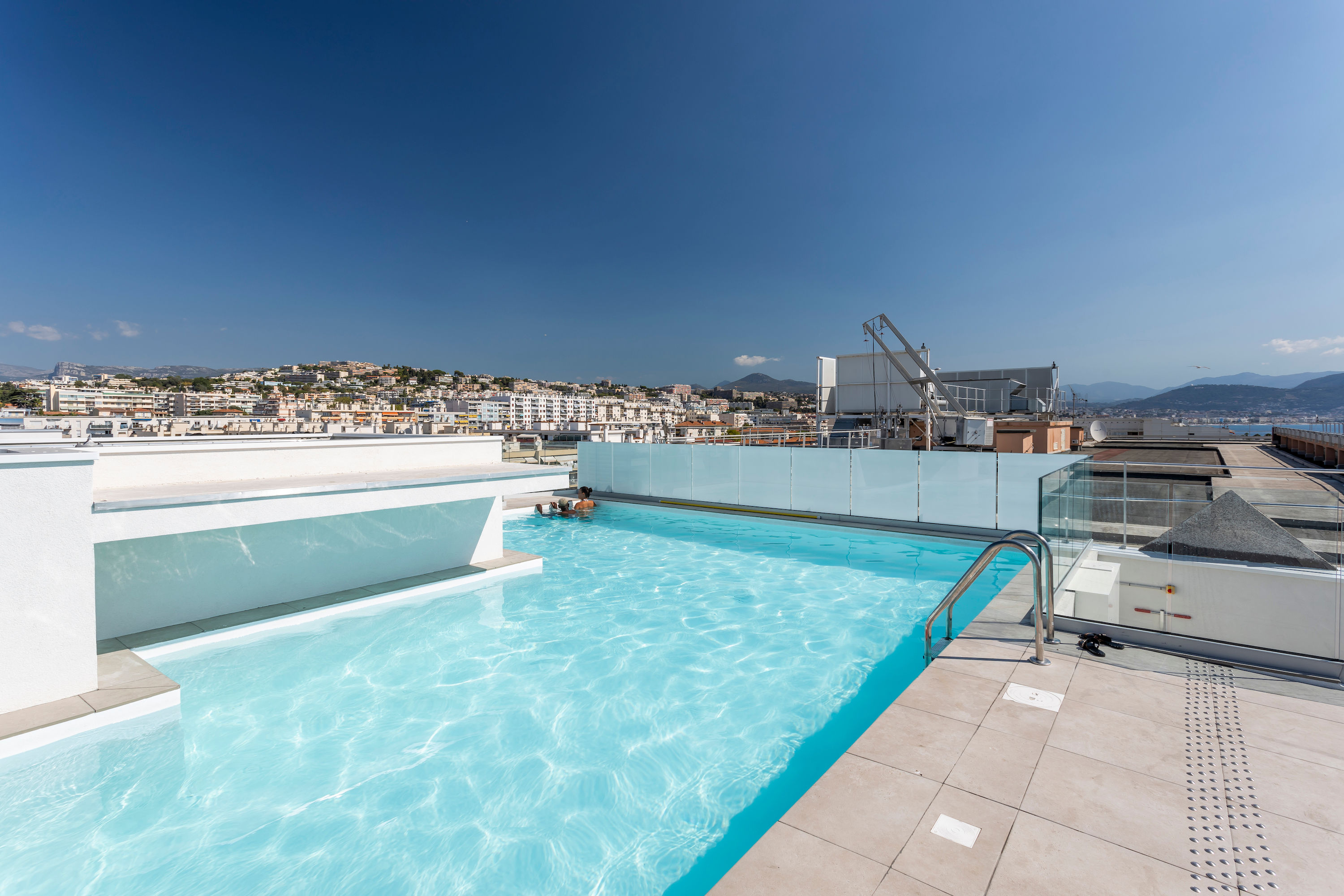 image Take a dip in the rooftop pool with panoramic city views.