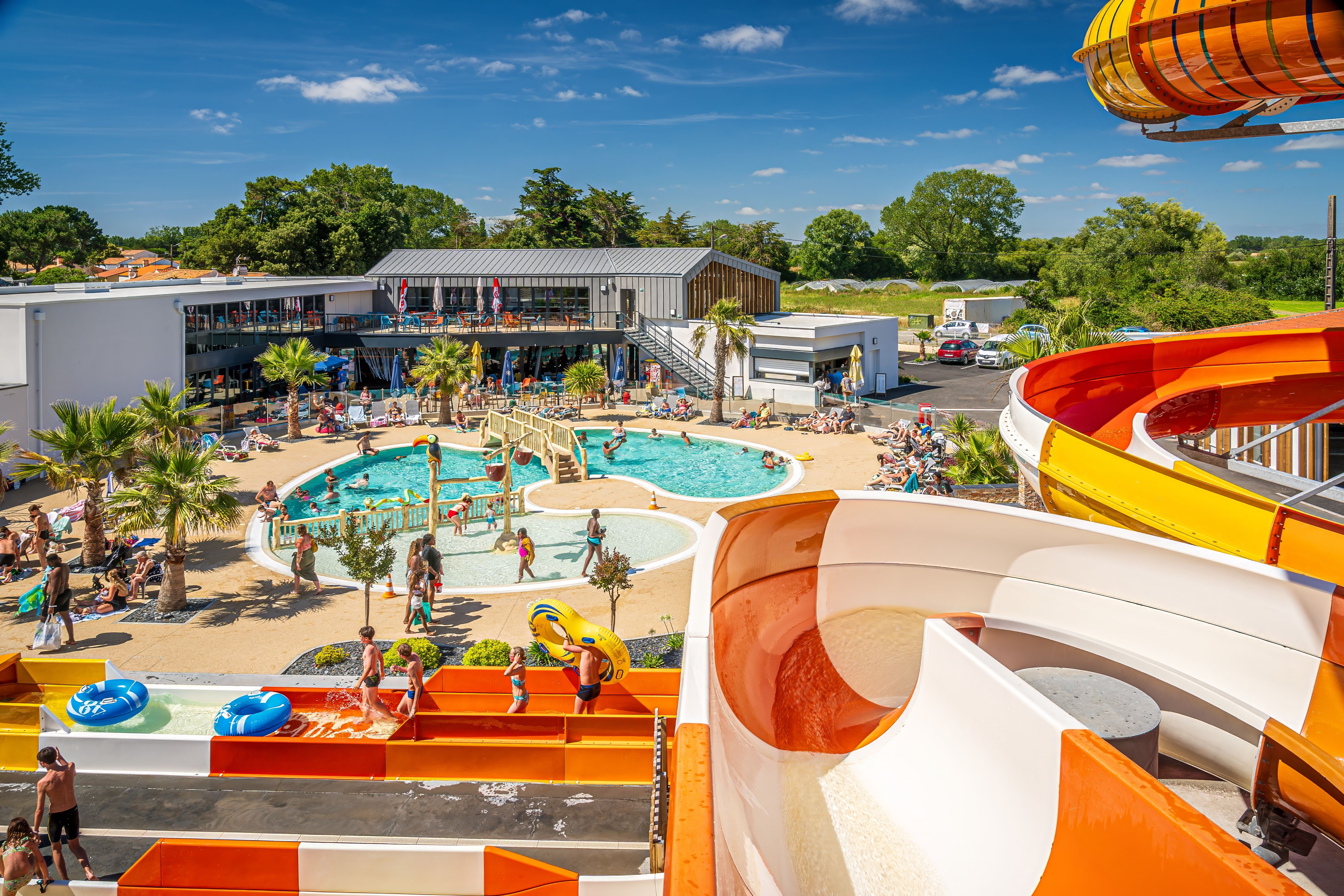 image A thrilling water park with twisting slides and splash zones, perfect for family fun in the sun.