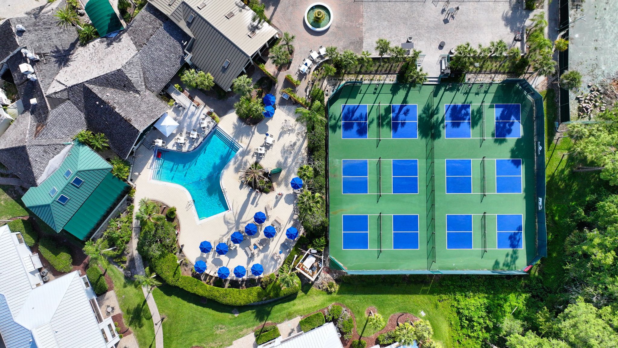 image Splash into paradise and play under the sun — pools and courts at your doorstep.