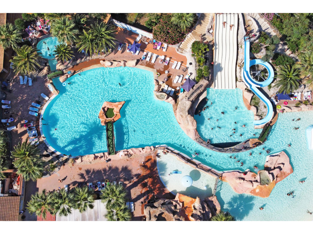 image Aerial view of a vibrant water park, featuring winding slides and multiple pools for endless fun.