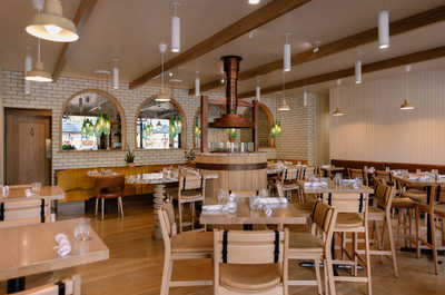 Enjoy dining in a cozy yet elegant setting, where rustic charm meets modern comfort, perfect for savoring delicious meals in style.