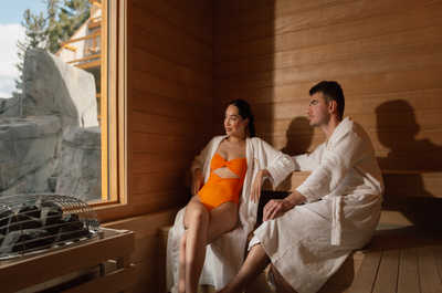 Relax and rejuvenate in a cozy, tranquil sauna, embraced by the warmth of natural wood and soft lighting.