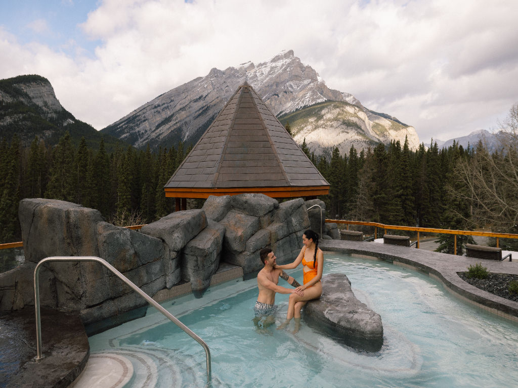 image Indulge in a serene mountain experience while soaking in the rooftop hot pool, surrounded by breathtaking views of towering peaks.