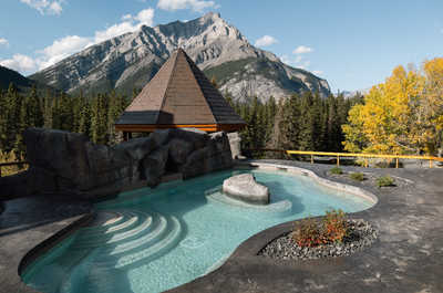 A rooftop oasis with a serene pool, framed by stunning mountain vistas and crisp, fresh air.