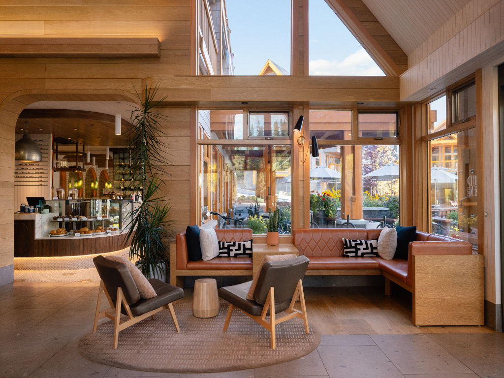 image Unwind in an elegant lounge with an open, airy design, where modern touches meet natural elements for a relaxing atmosphere.