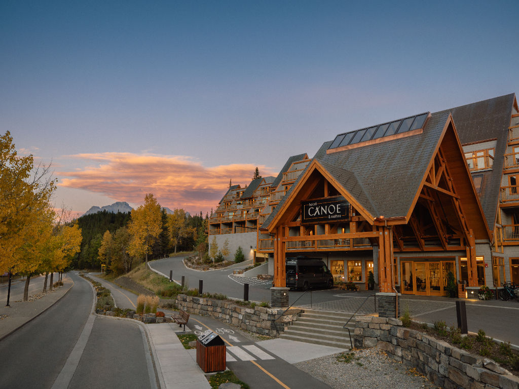 image Admire the stunning architecture and warm welcome of Hotel Canoe and Suites, nestled amidst breathtaking surroundings.