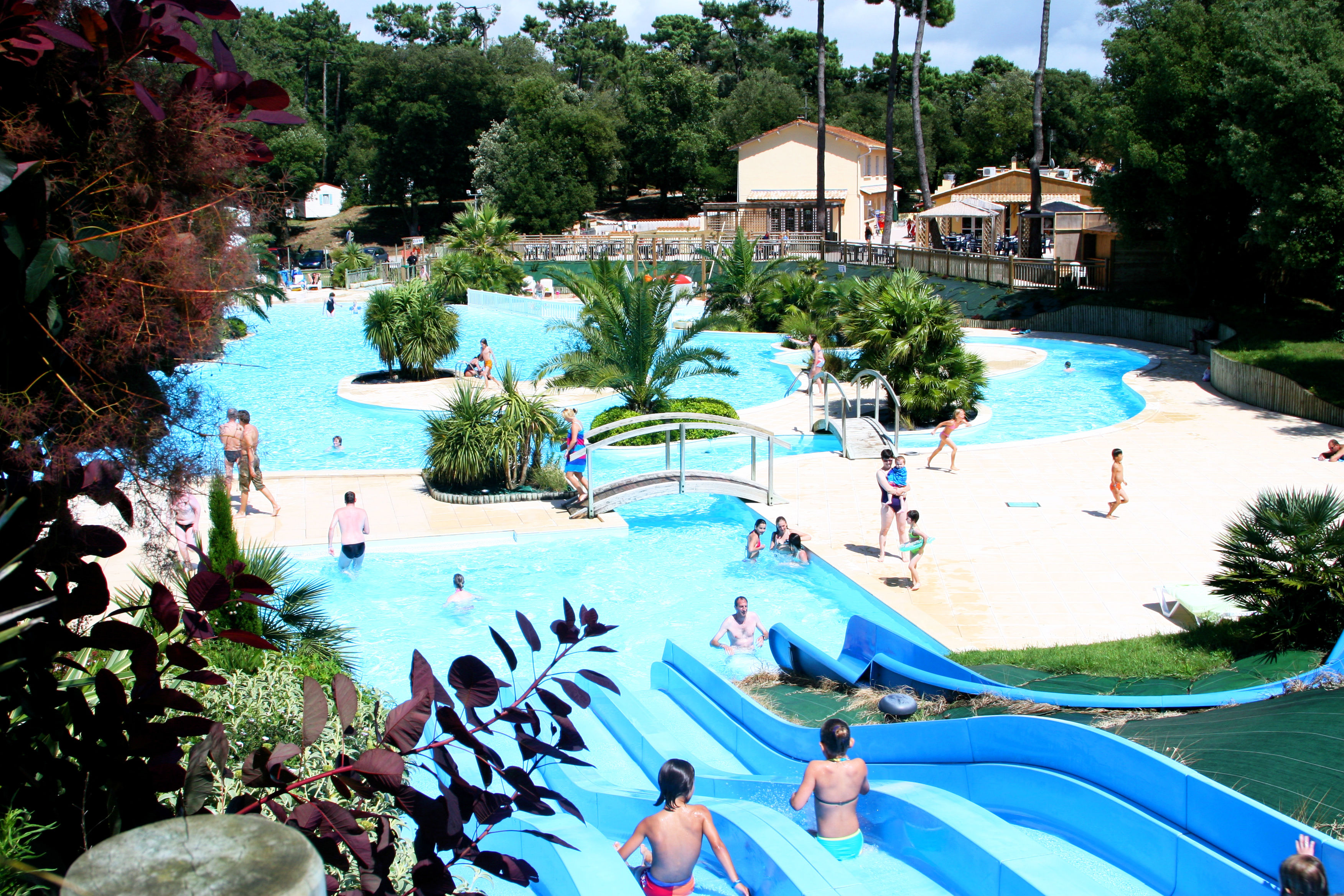 image Immerse in the serenity of Le Logis's sprawling aquatic oasis.