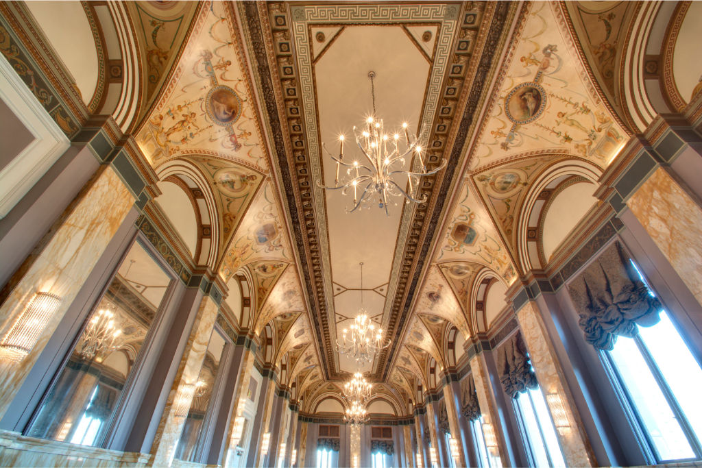 image Host your next event in this stunning meeting room with ornate ceilings and abundant natural light. Perfect for conferences, seminars, and workshops.