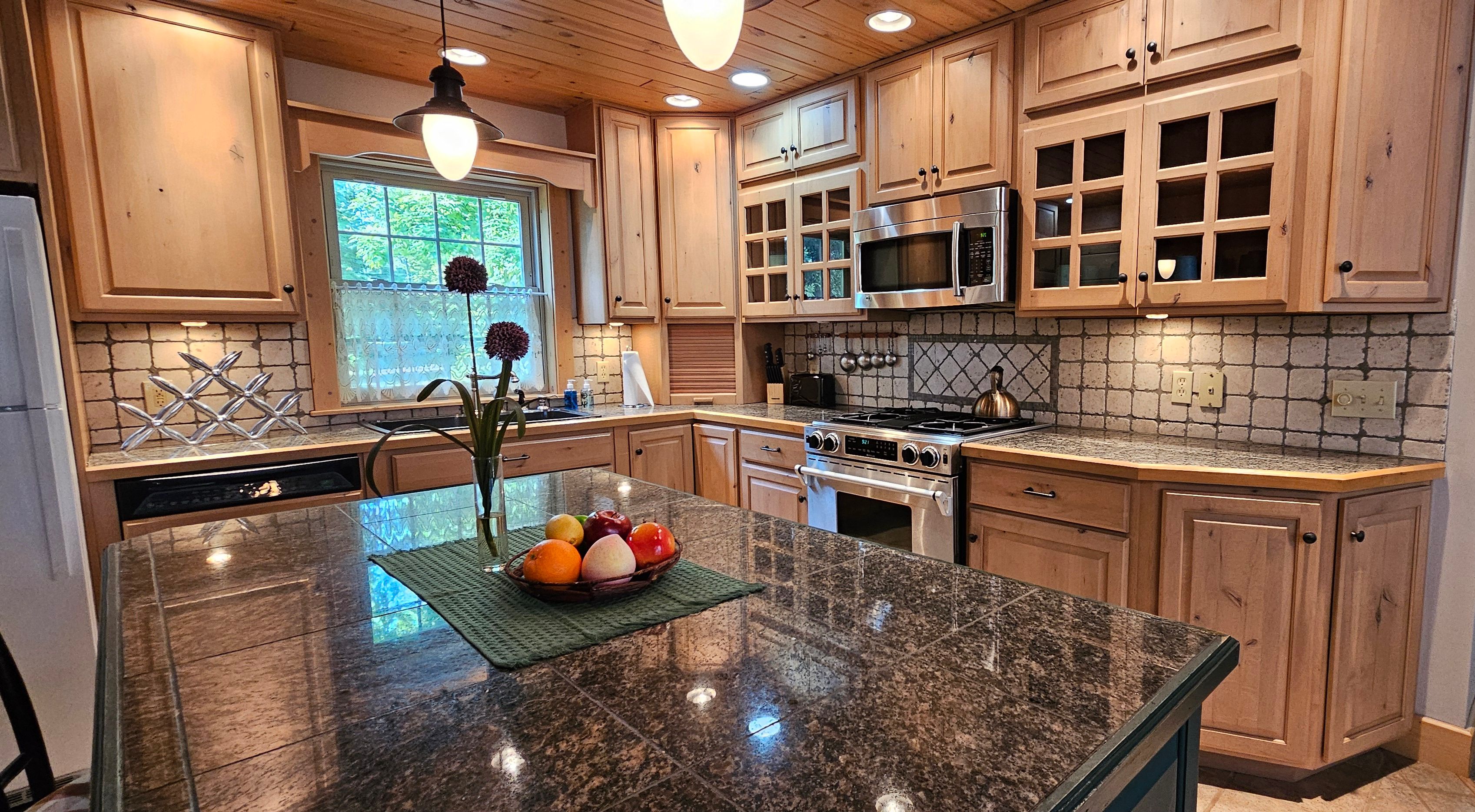 image Cook your favorite meals in this spacious kitchen featuring modern appliances and plenty of counter space.
