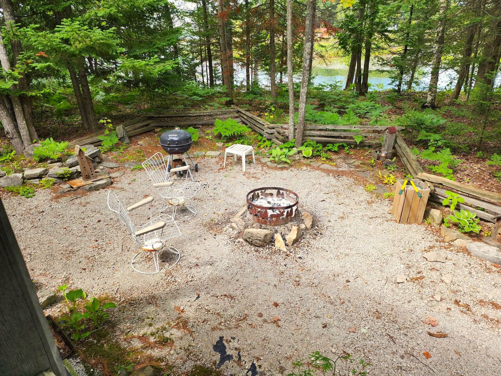 image Gather around the outdoor fire pit for a cozy evening under the stars, complete with seating for everyone.