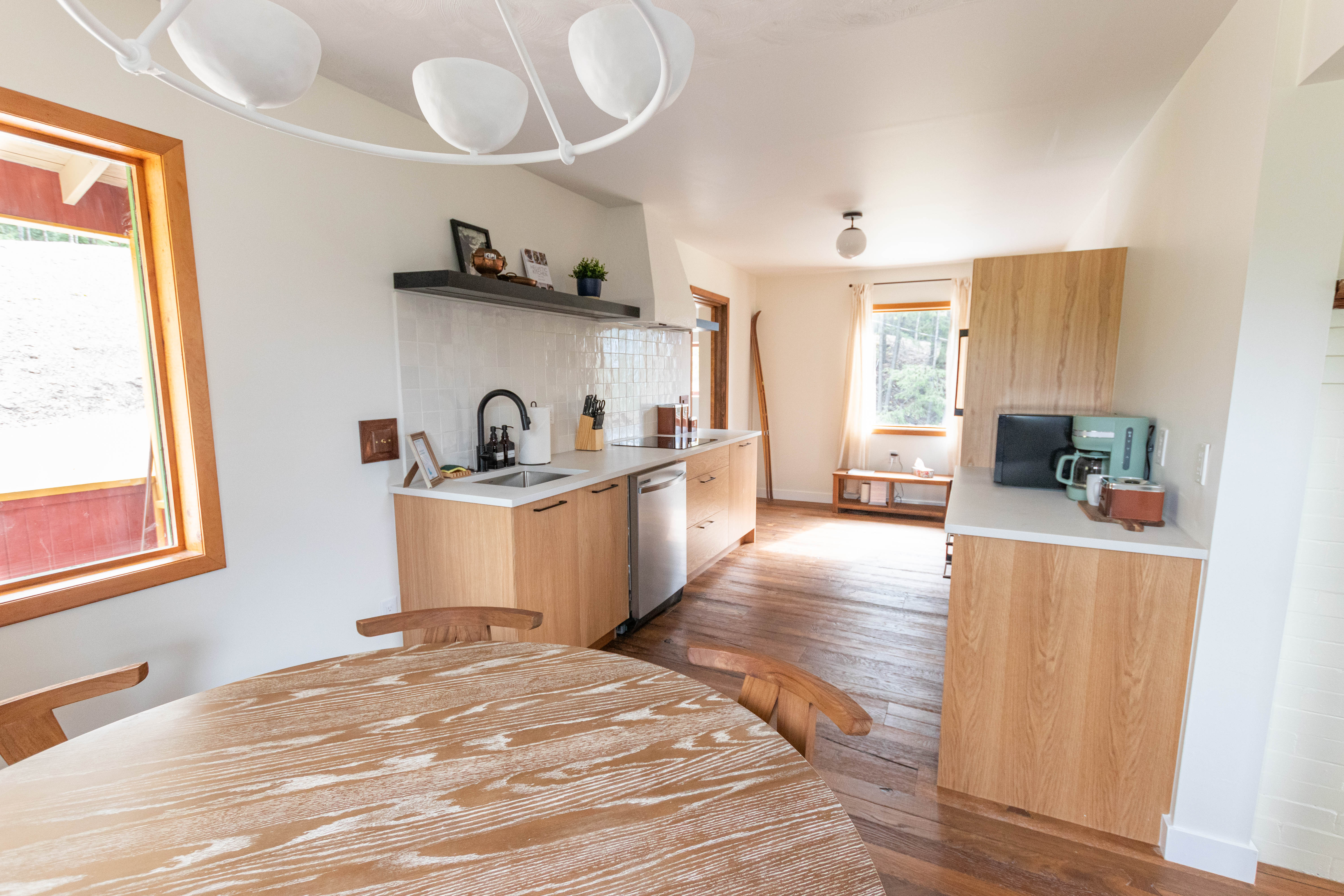 image Relax in this stylish kitchen, blending modern design with comfortable living.