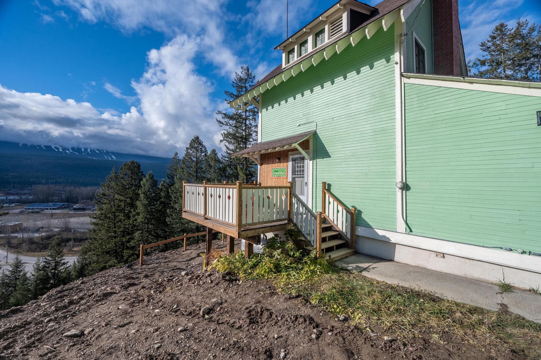 image Enjoy the details of the historic architecture, framed by lush trees and a clear blue sky.