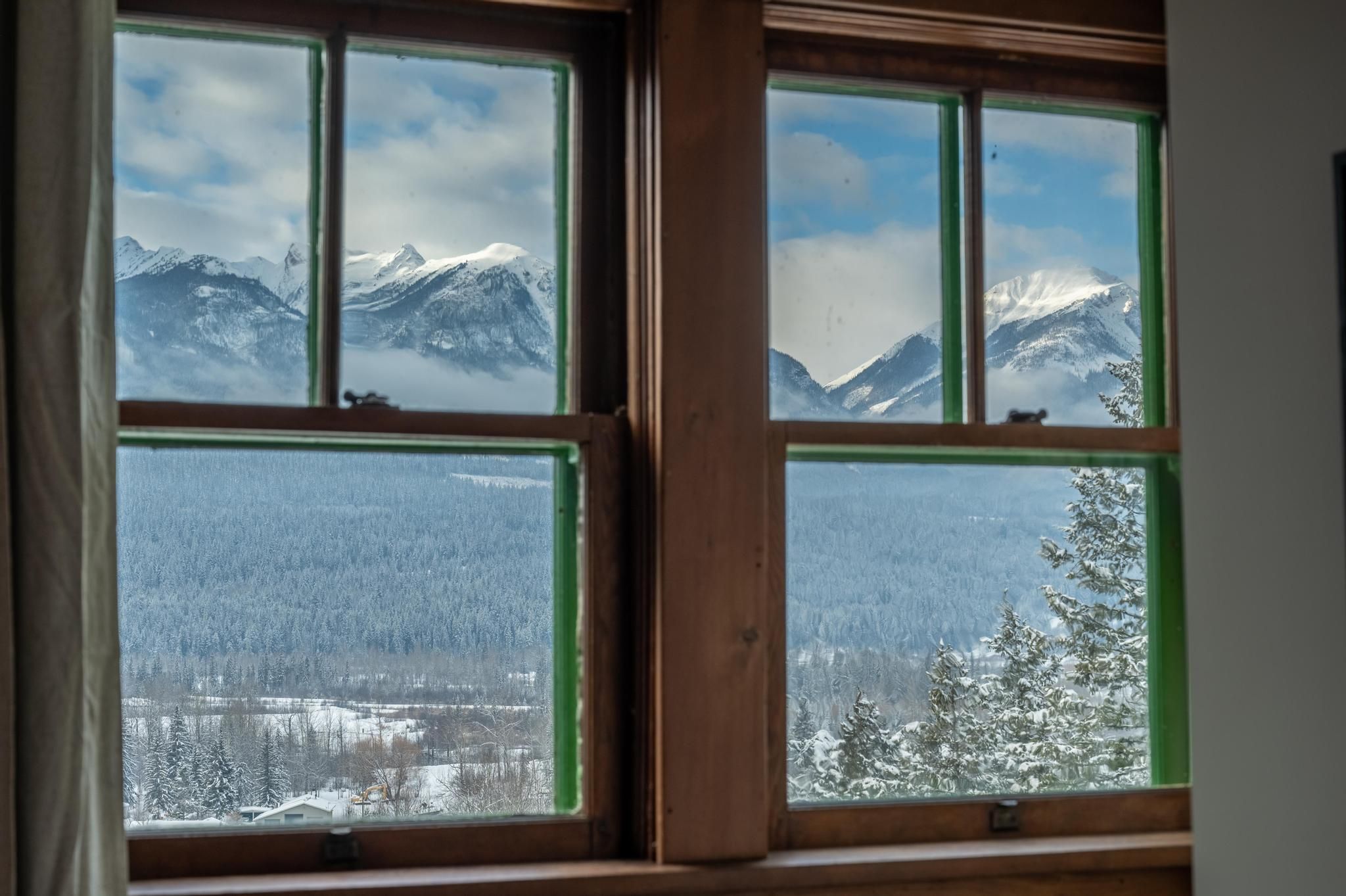 image Breathtaking mountain views framed by the chalet's rustic wood windows, creating a serene connection to nature.